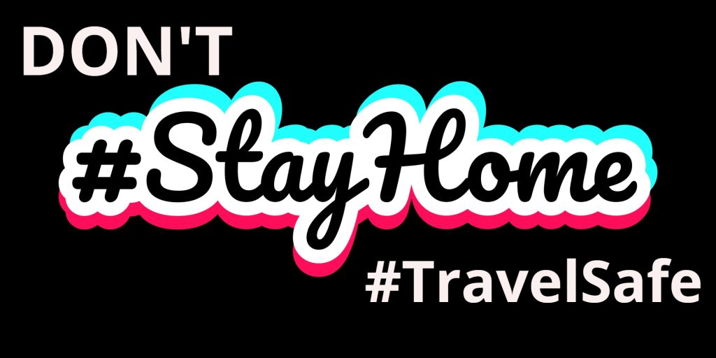 A banner saying Dont stay at home #travelsafe