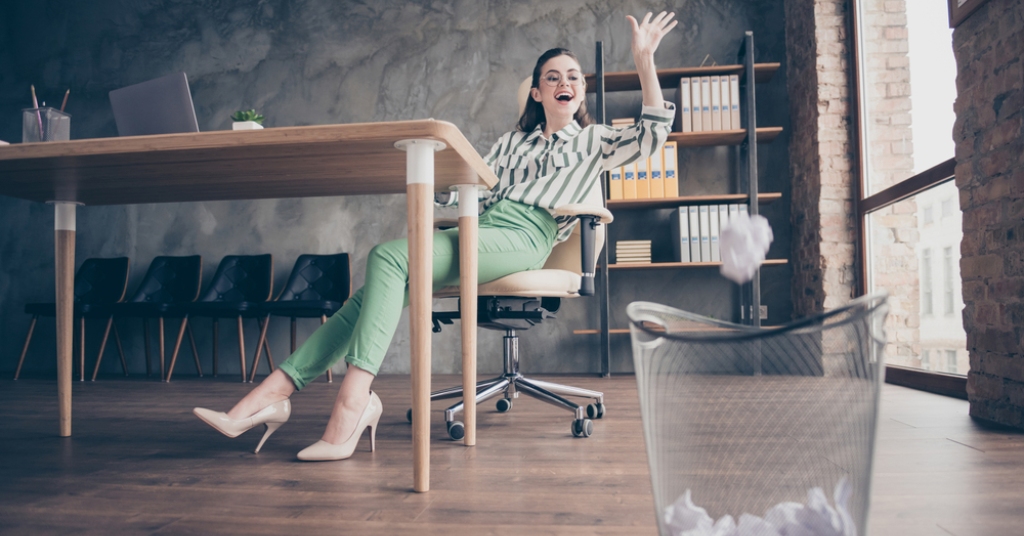 A marketing girl throws an agency proposal in the bin