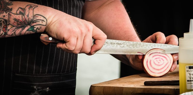 Jamie Scott cutting an onion|Jamie Scott winner of 2014 Masterchef|