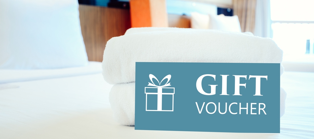 Hotel with gift vouchers sitting on the bed