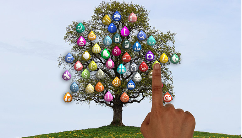 Tree with social media icons growing on trees with a finger clicking on one of them