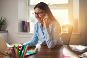 Woman in home office on the phone