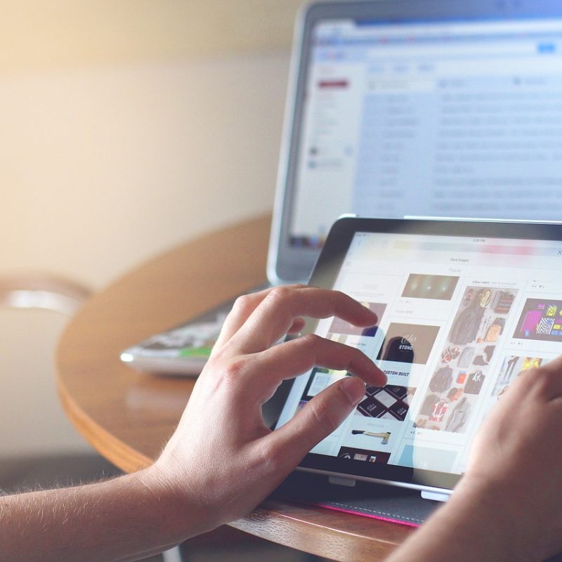 A picture of a person searching using an ipad