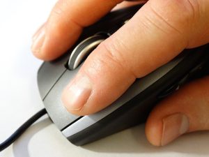 Hand clicking a mouse