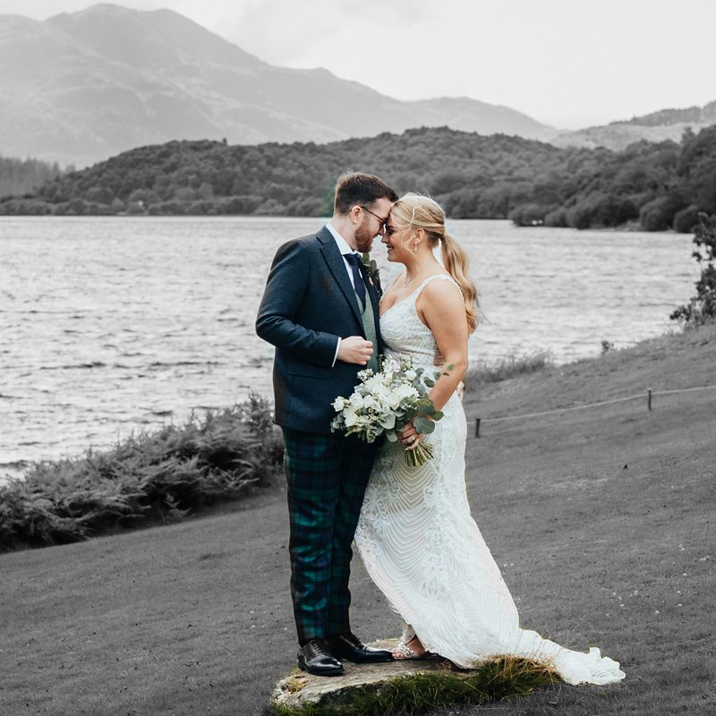 A bride and groom at Venachar Lochside for their wedding