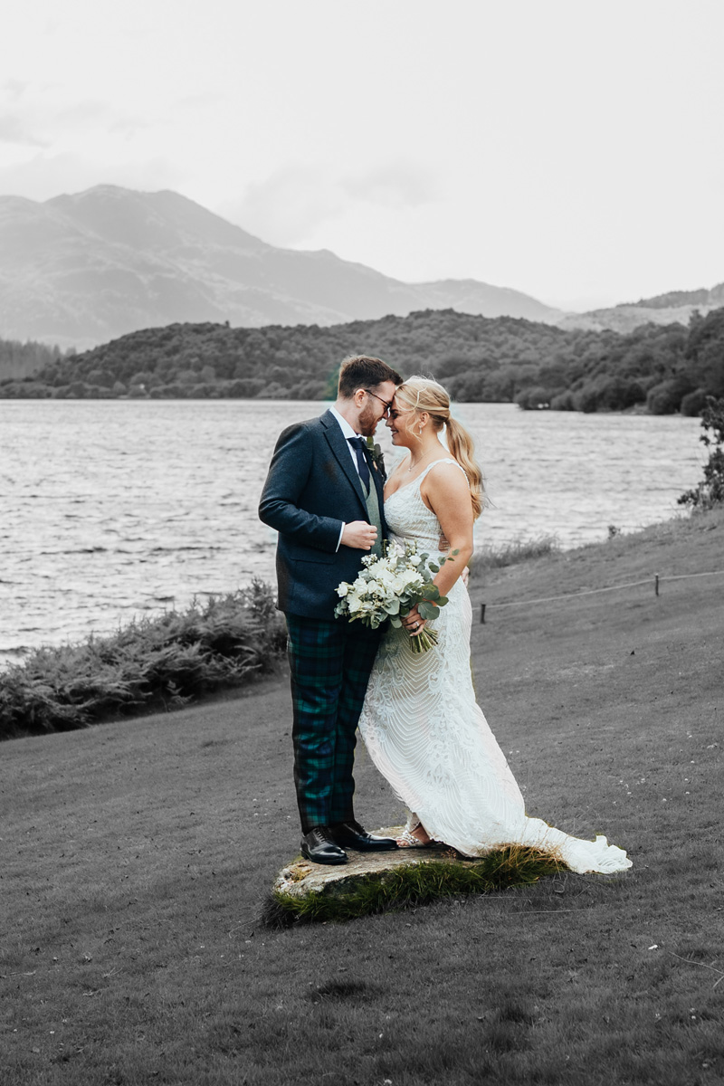 A bride and groom at Venachar Lochside for their wedding