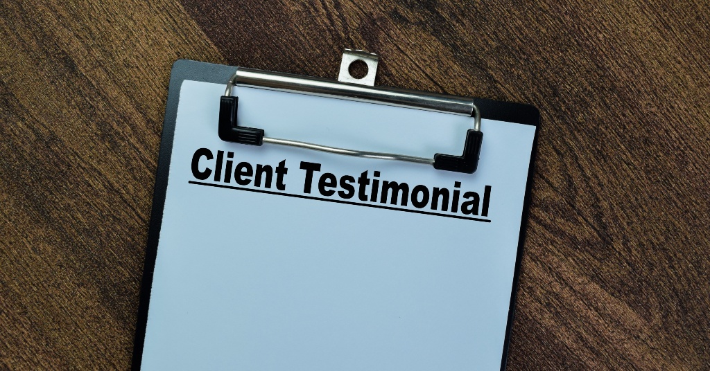 client testimonials written on paper on a clipboard