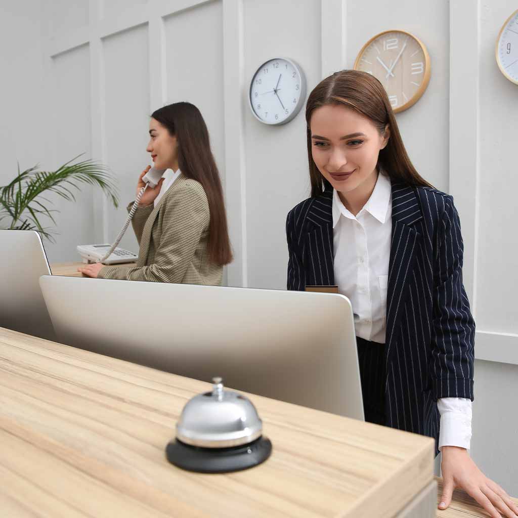 Receptionists at a hotel desk