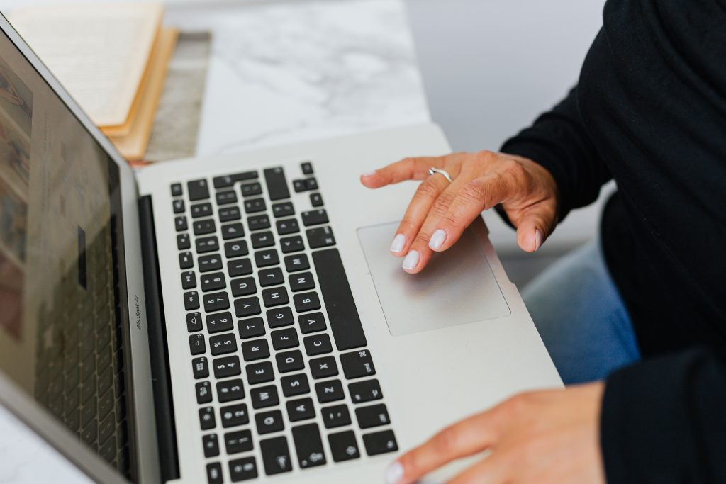 Clicking laptop to book a hotel website design